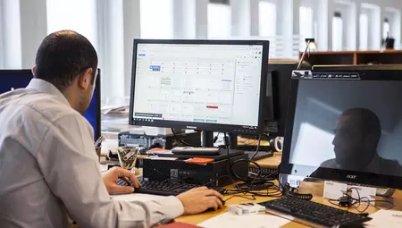 Man in front of a computer with eSpace