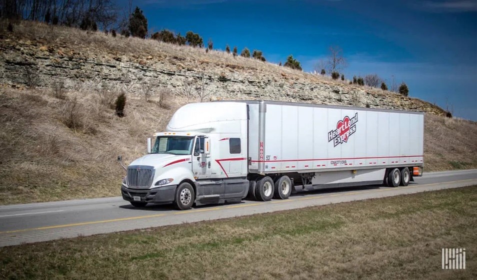 An image of a Heartland Dry Van truck on the road