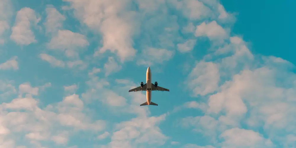 Airplane flying in blue sky