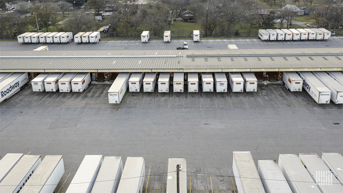 A visual of dry van trailers in a lot