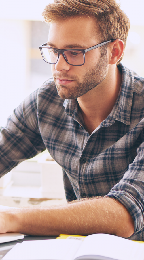 a man in front of his laptop