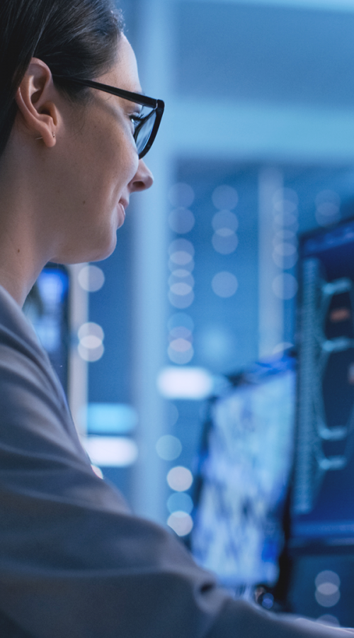 a woman consults a computer screen