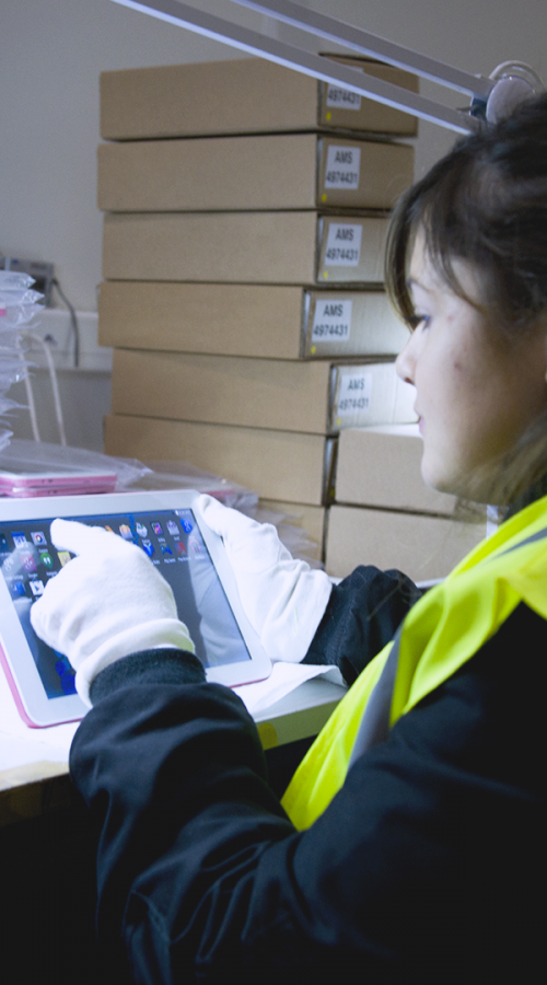 a technician uses a tablet