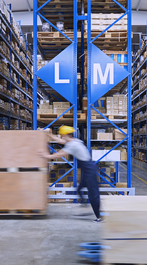 an employee moves parcels in a warehouse