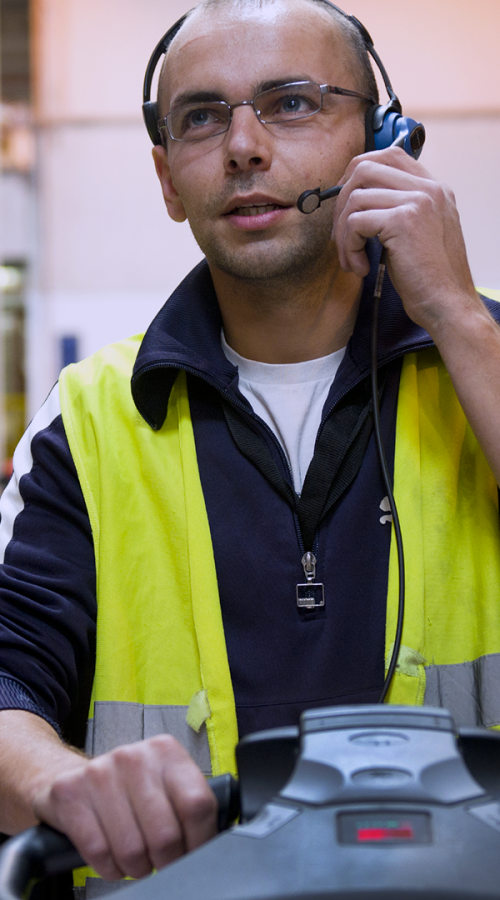 an employee drives and communicates with his colleagues