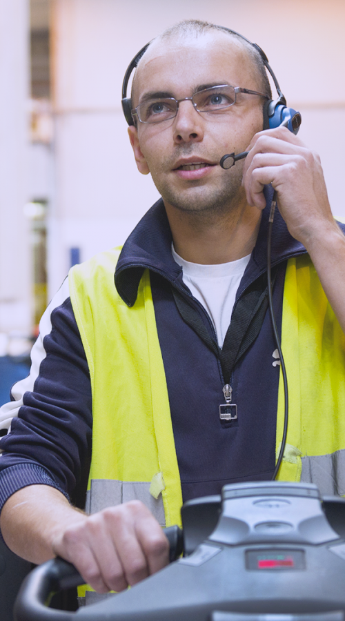 an employee drives and communicates with his colleagues