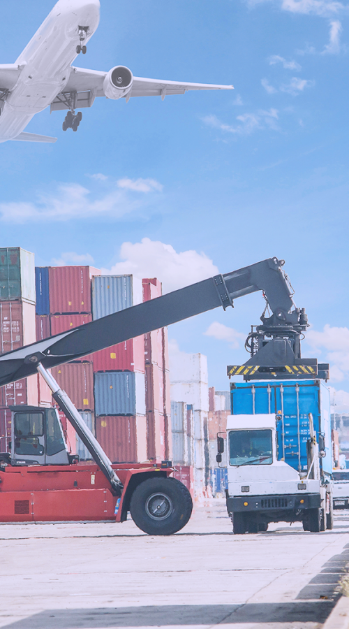 an airplane, containers and a truck on a harbor