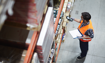 An image of a warehouse worker checking stock