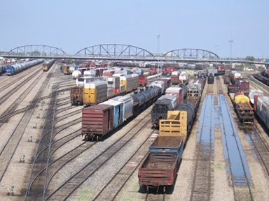 An image of freight cars on a railroad