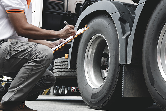 Image of man taking notes for truck repair