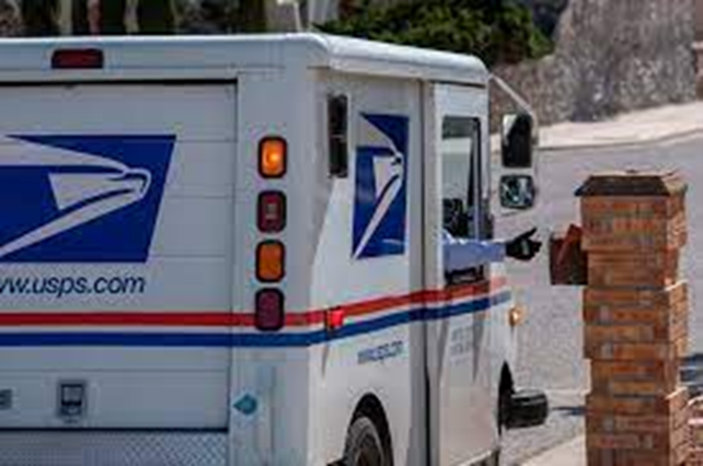 A picture showing a USPS postal truck